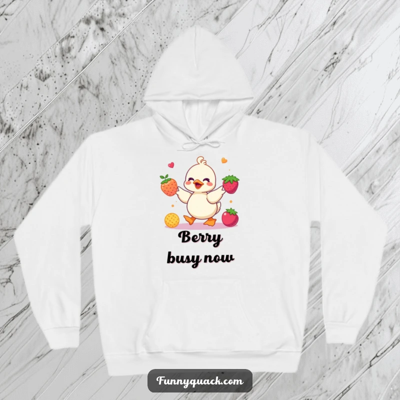 Funny kawaii duck hoodie featuring a cute duck character juggling colorful abstract berries, designed for cozy, humorous fun.